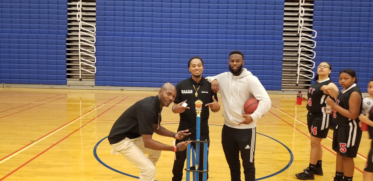 Elite Playmakers 2018 coaches with championship trophy