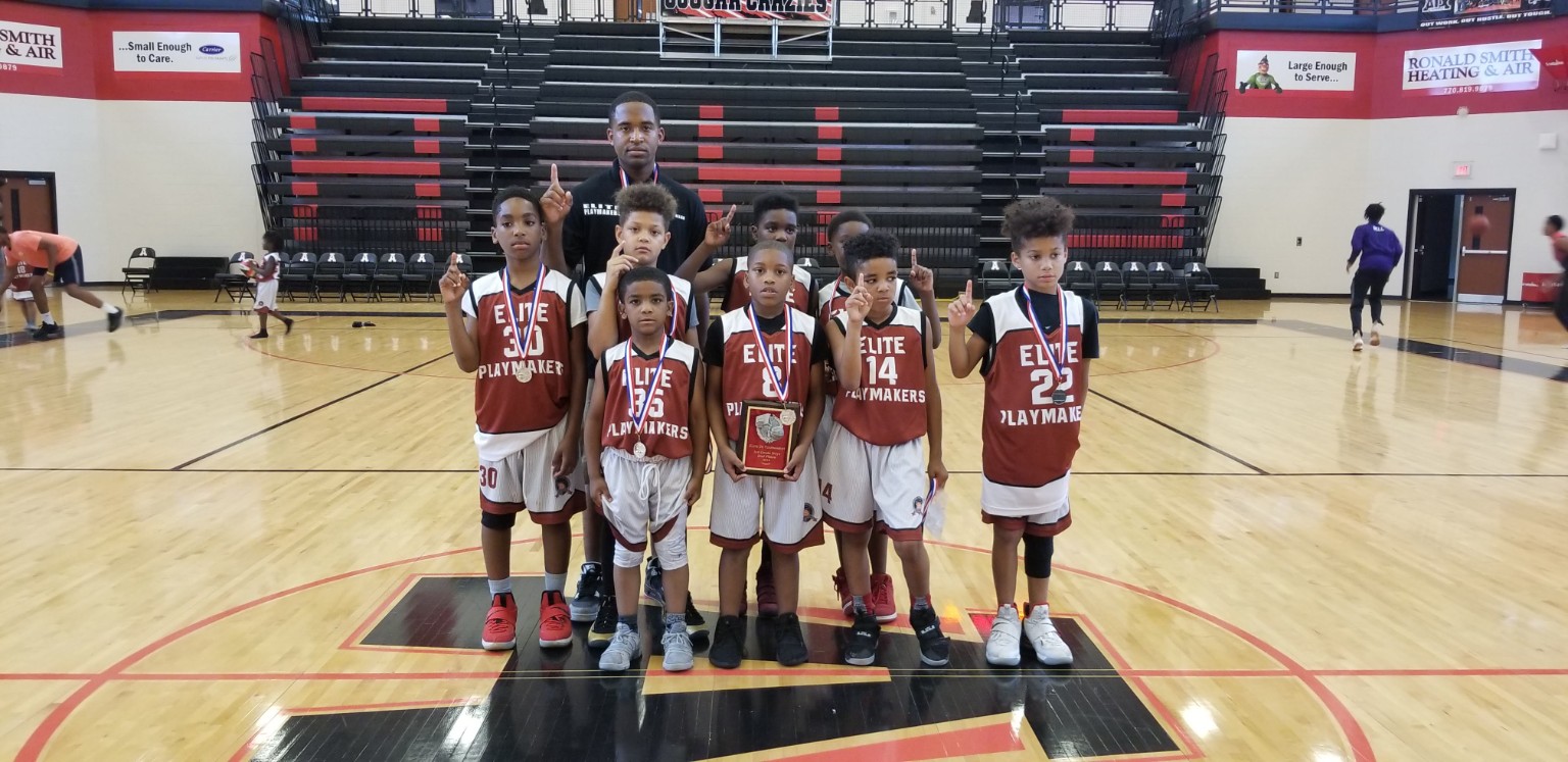 Elite Playmakers 2018 youth championship team with medals and plaque