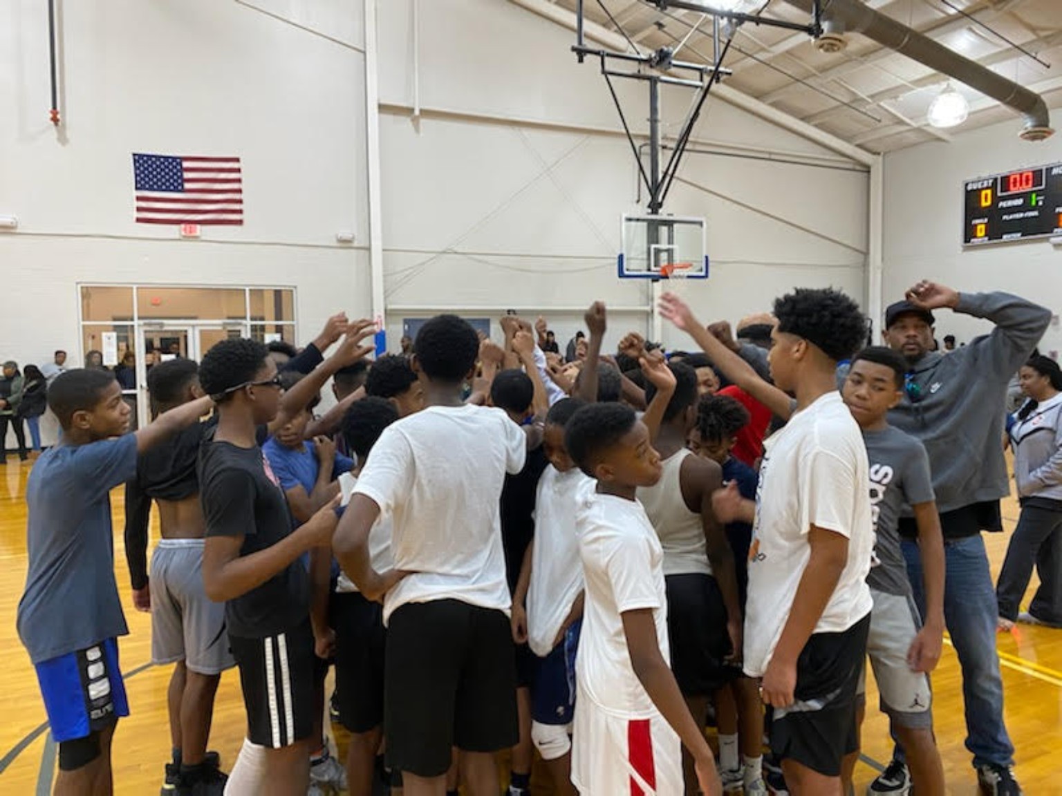 Elite Playmakers 2020 players listening during a team huddle