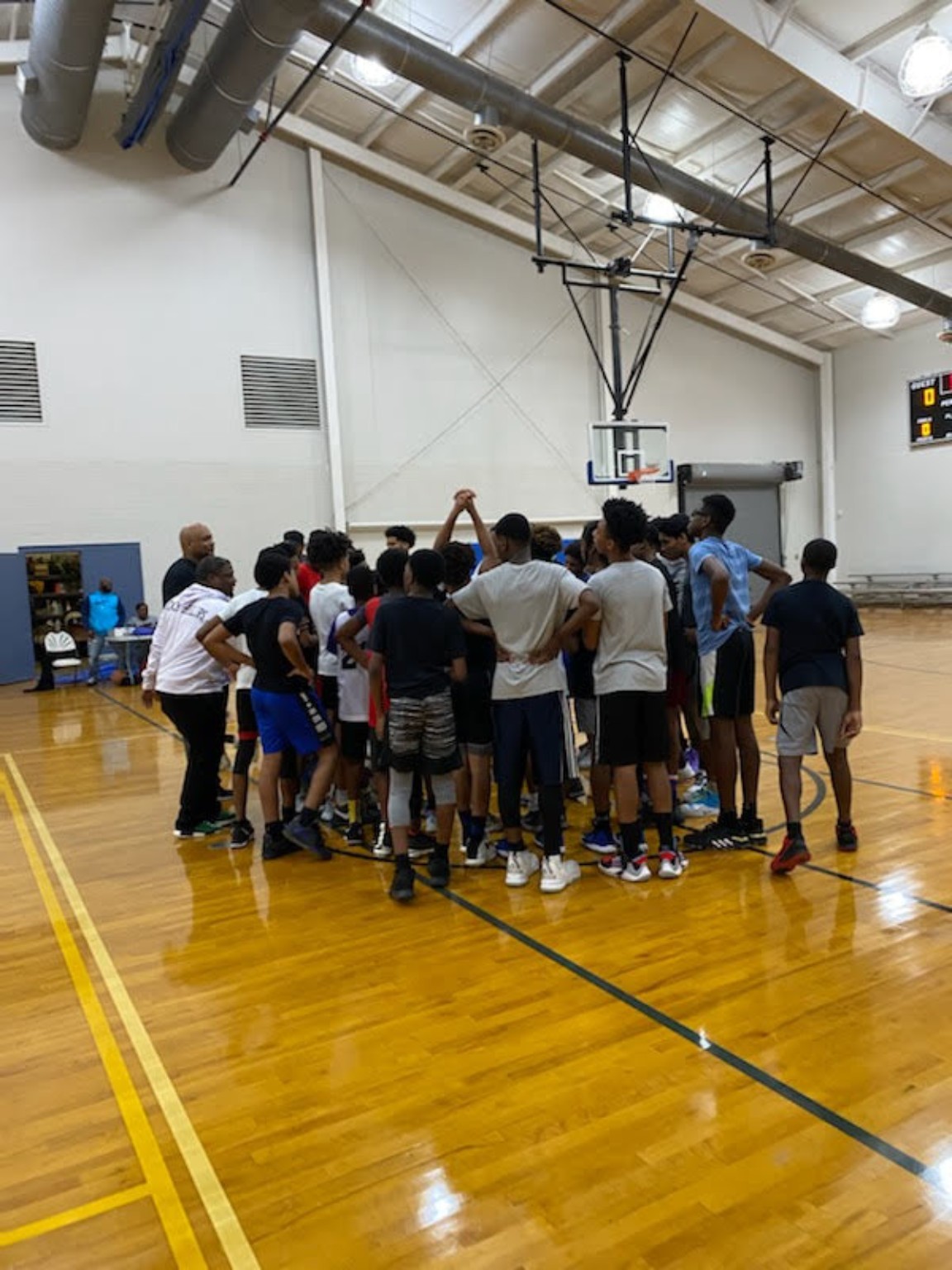 Elite Playmakers 2020 players gathered around their coaches
