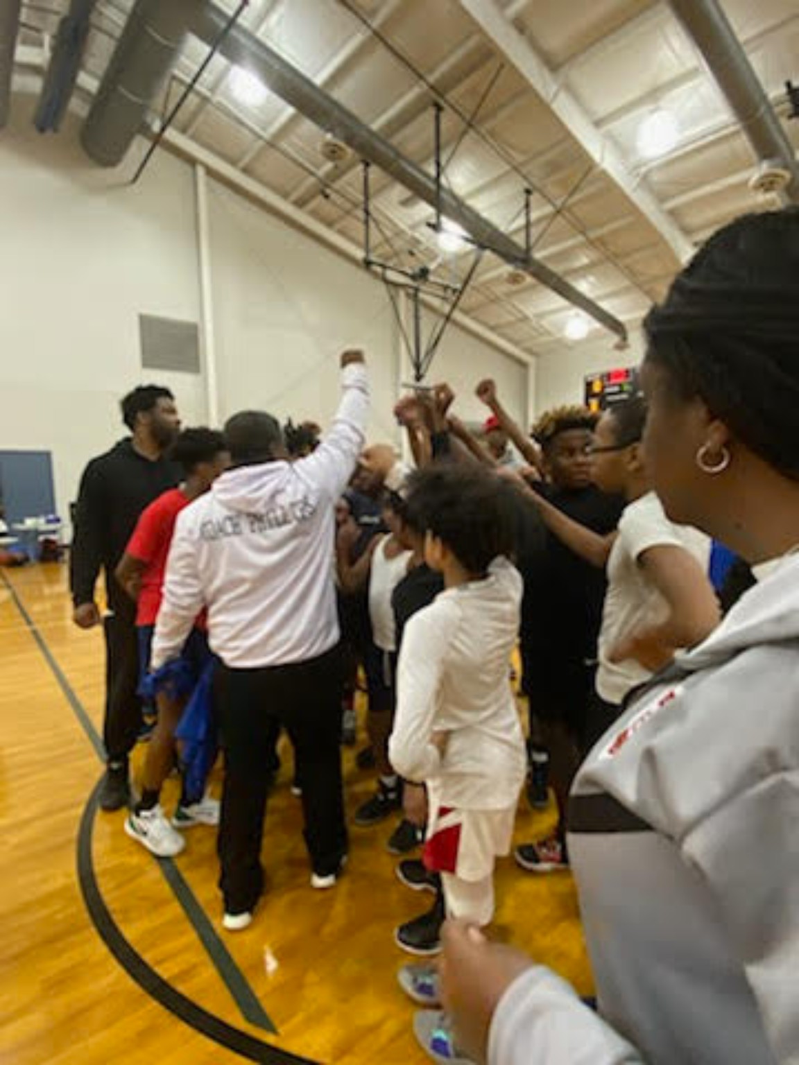 Elite Playmakers 2020 team huddle with coaches