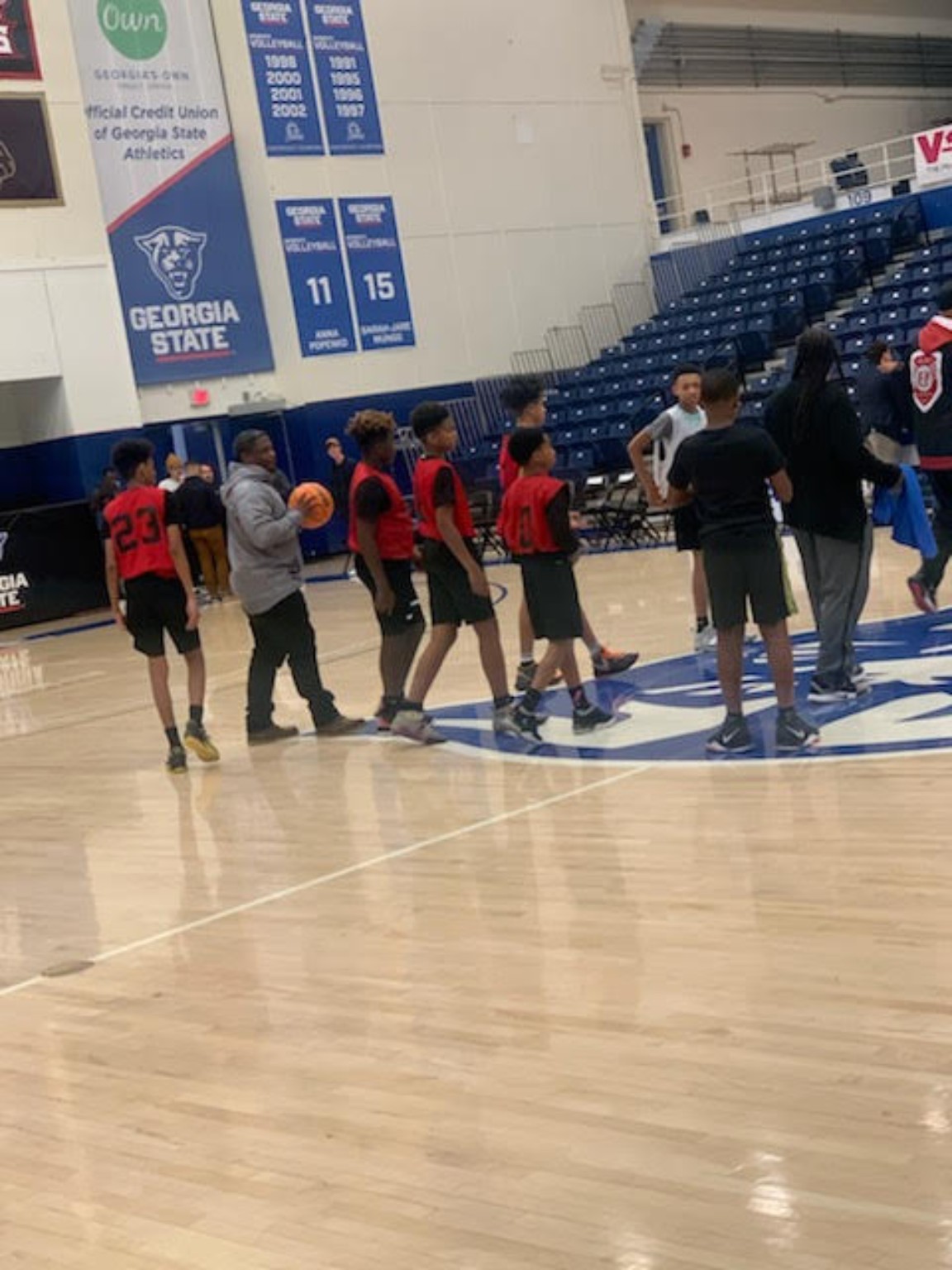 Elite Playmakers 2020 coaches and players on the Georgia State court