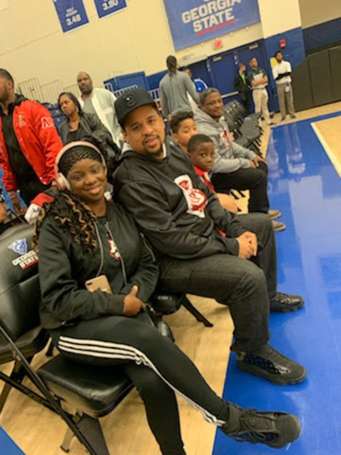 Elite Playmakers 2020 coaches and families along the Georgia State sideline