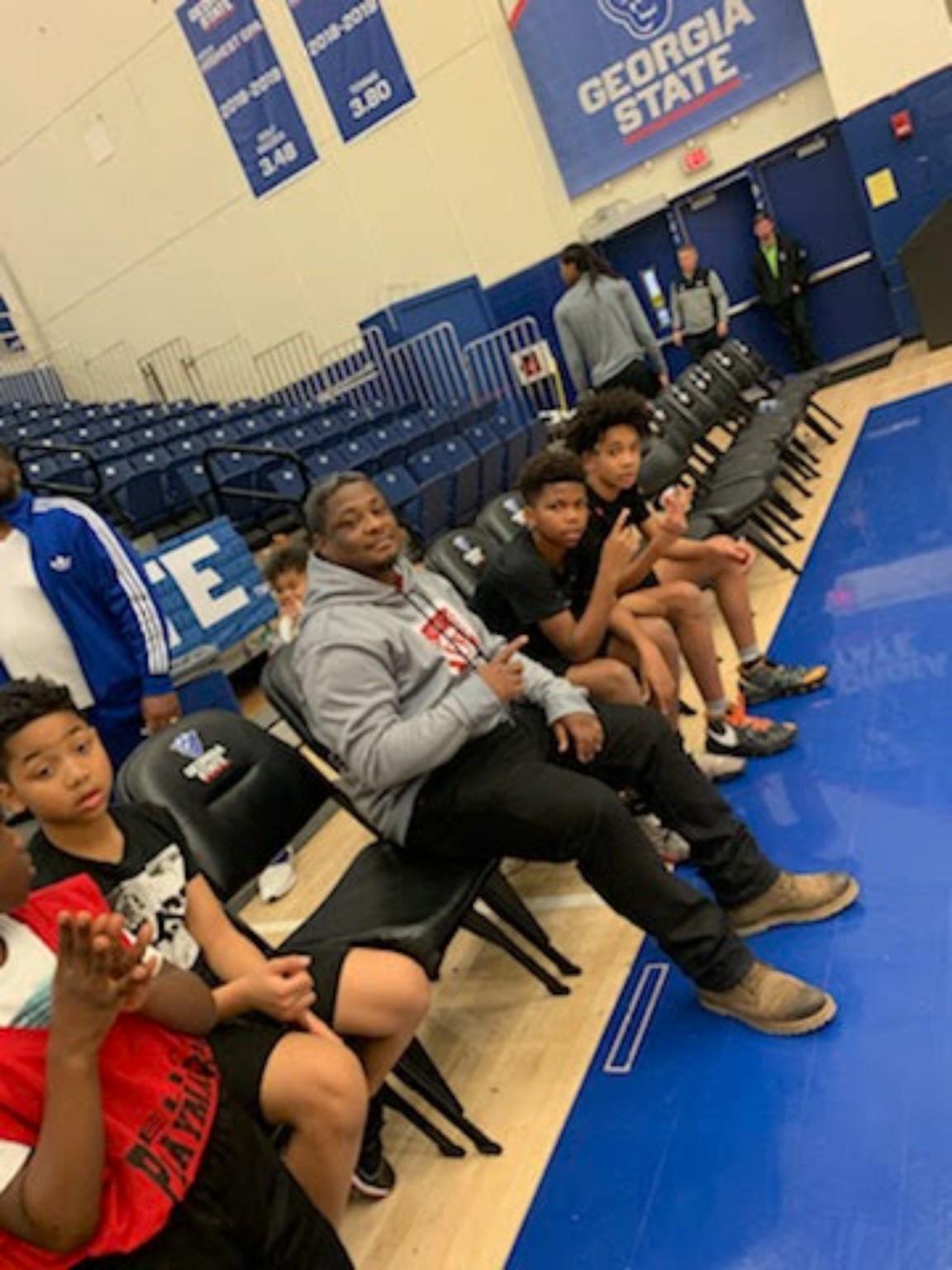 Elite Playmakers 2020 players seated courtside at Georgia State
